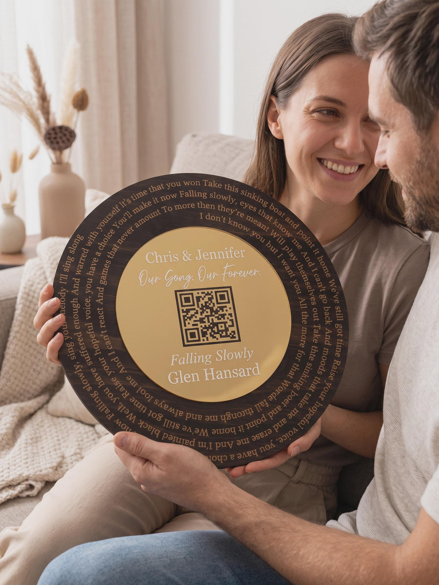 Wooden song record with a QR code engraved on the gold mirror center, lyrics spiralling around it