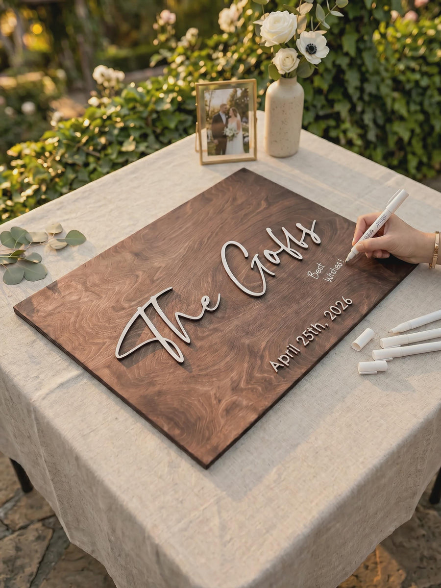 Rectangular wooden family name guest book sign with the couple's last name and wedding date in raised 3D script, Jacobean finish.