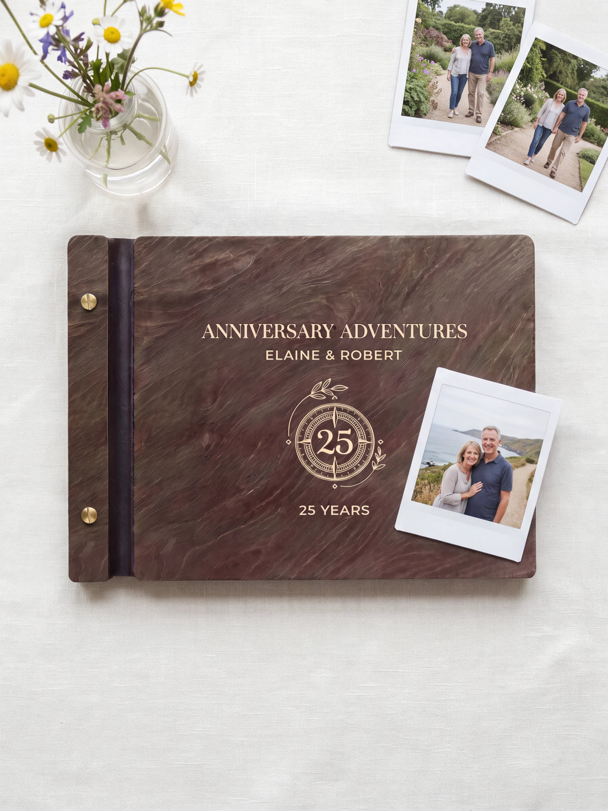 Dark brown Jacobean wooden album on a light surface, with cream engraving of a circular 25-year anniversary emblem and personalized cover wording. The full cover and left screw binding are visible.