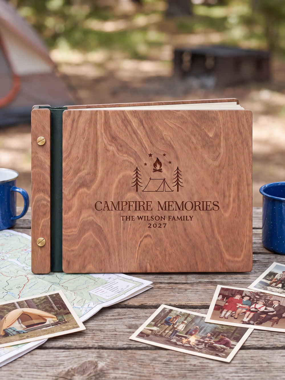 The full Hazelnut CAMPFIRE MEMORIES album cover is shown close up. Brown engraved artwork, personalized wording, the narrow binding and gold screws are visible.