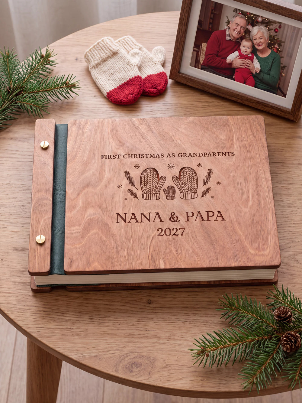 The full Hazelnut FIRST CHRISTMAS AS GRANDPARENTS album cover is shown close up. Brown engraved artwork, personalized wording, the narrow binding and gold screws are visible.