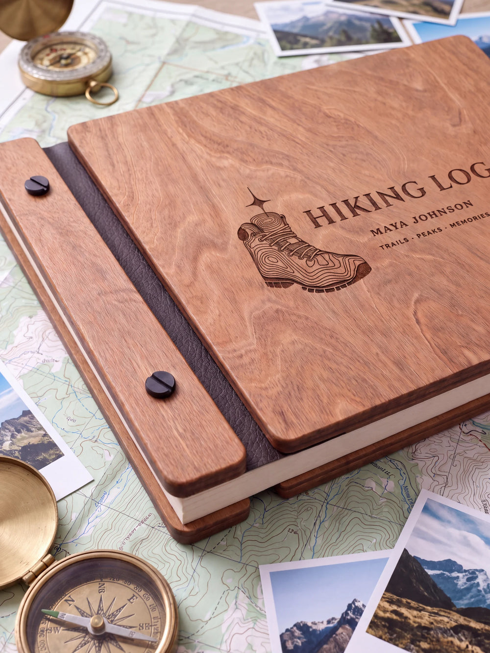 Close view of the Hazelnut album’s brown engraving, binding and black screw heads. Cream page edges and separate wooden cover sections are visible.