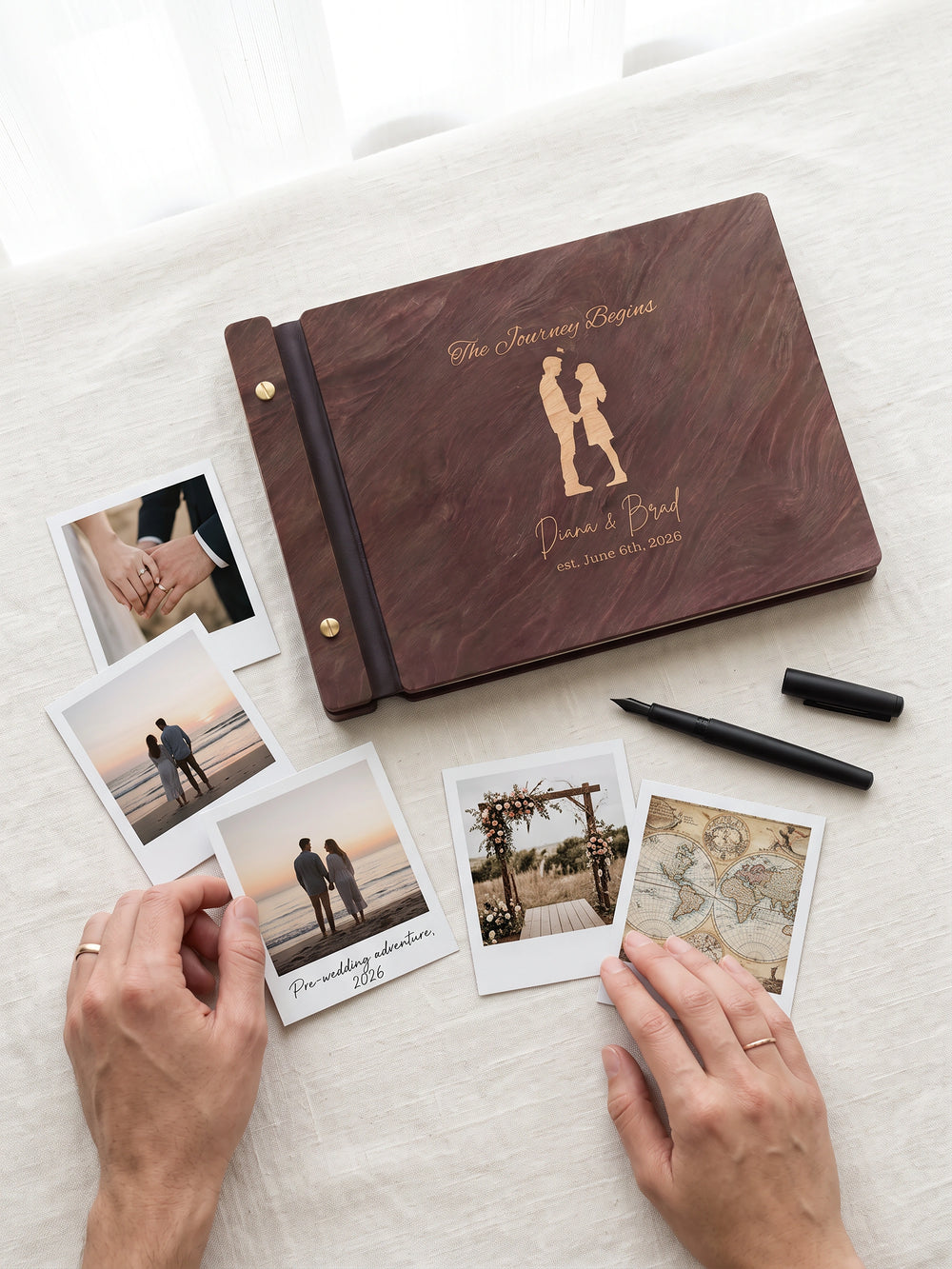 The Journey Begins photo guest book with a Jacobean wood cover, vegan leather spine and screw posts