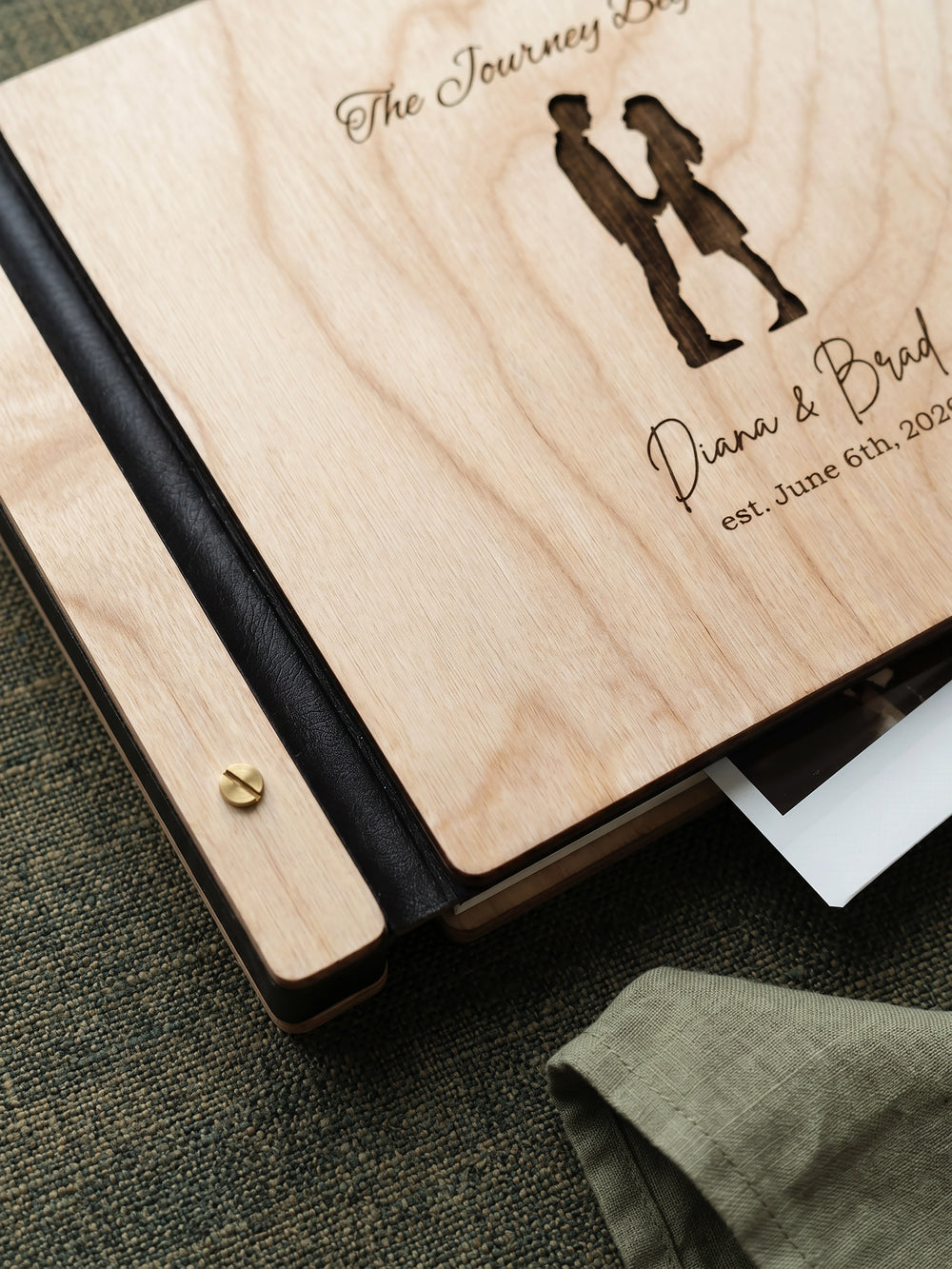 The Journey Begins photo guest book with a Natural wood cover, vegan leather spine and screw posts
