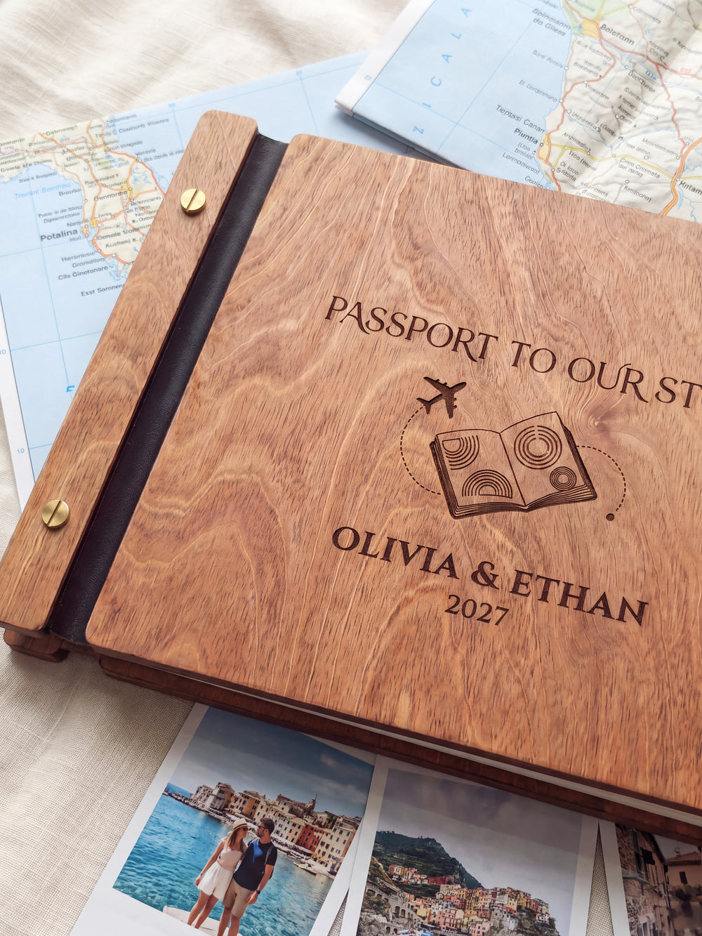 Close-up of a passport and airplane engraved in dark brown on the Hazelnut wooden cover, showing the fine artwork and surrounding wood grain.