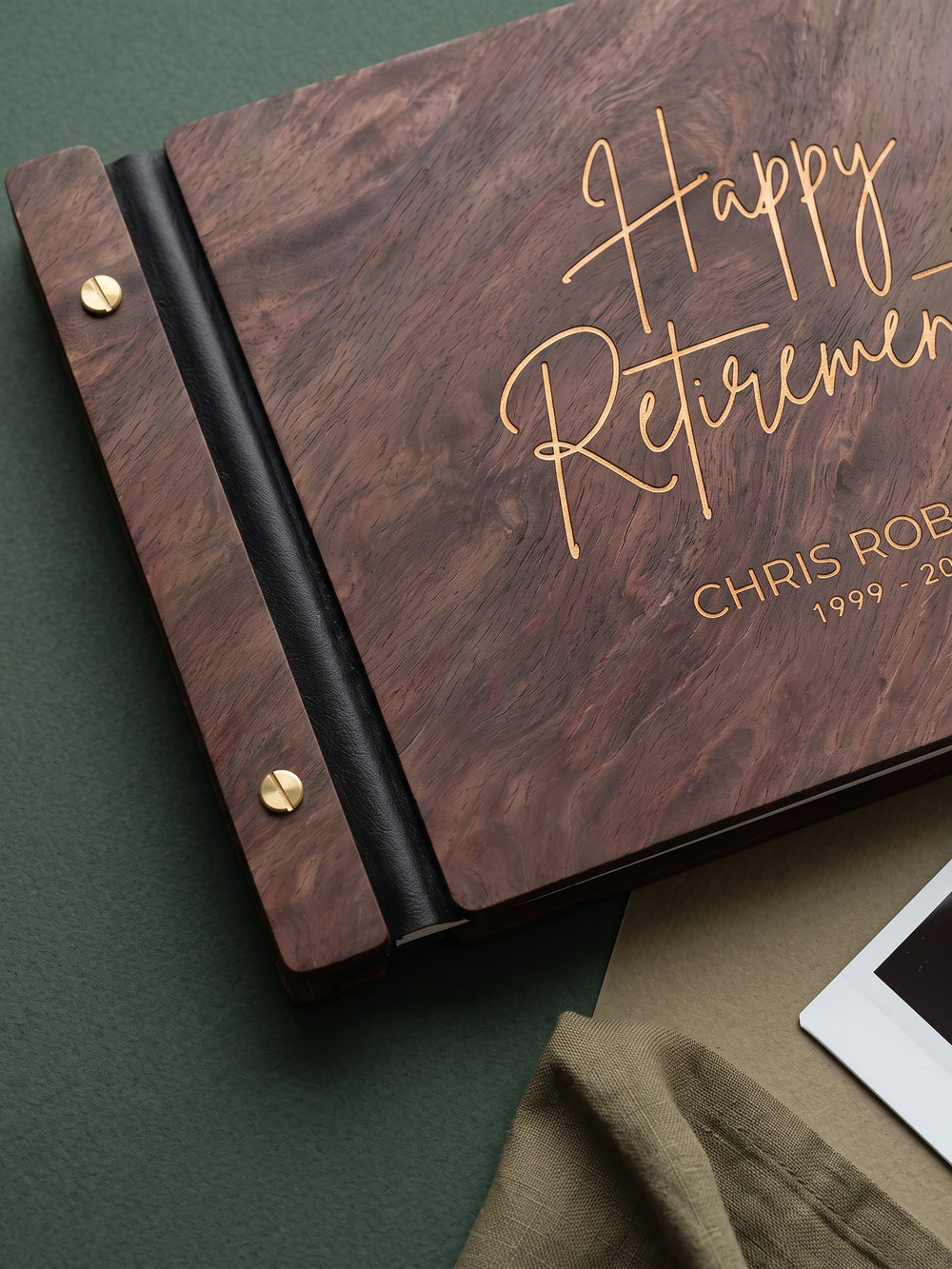 Happy Retirement photo guest book with a Jacobean wood cover, vegan leather spine and screw posts