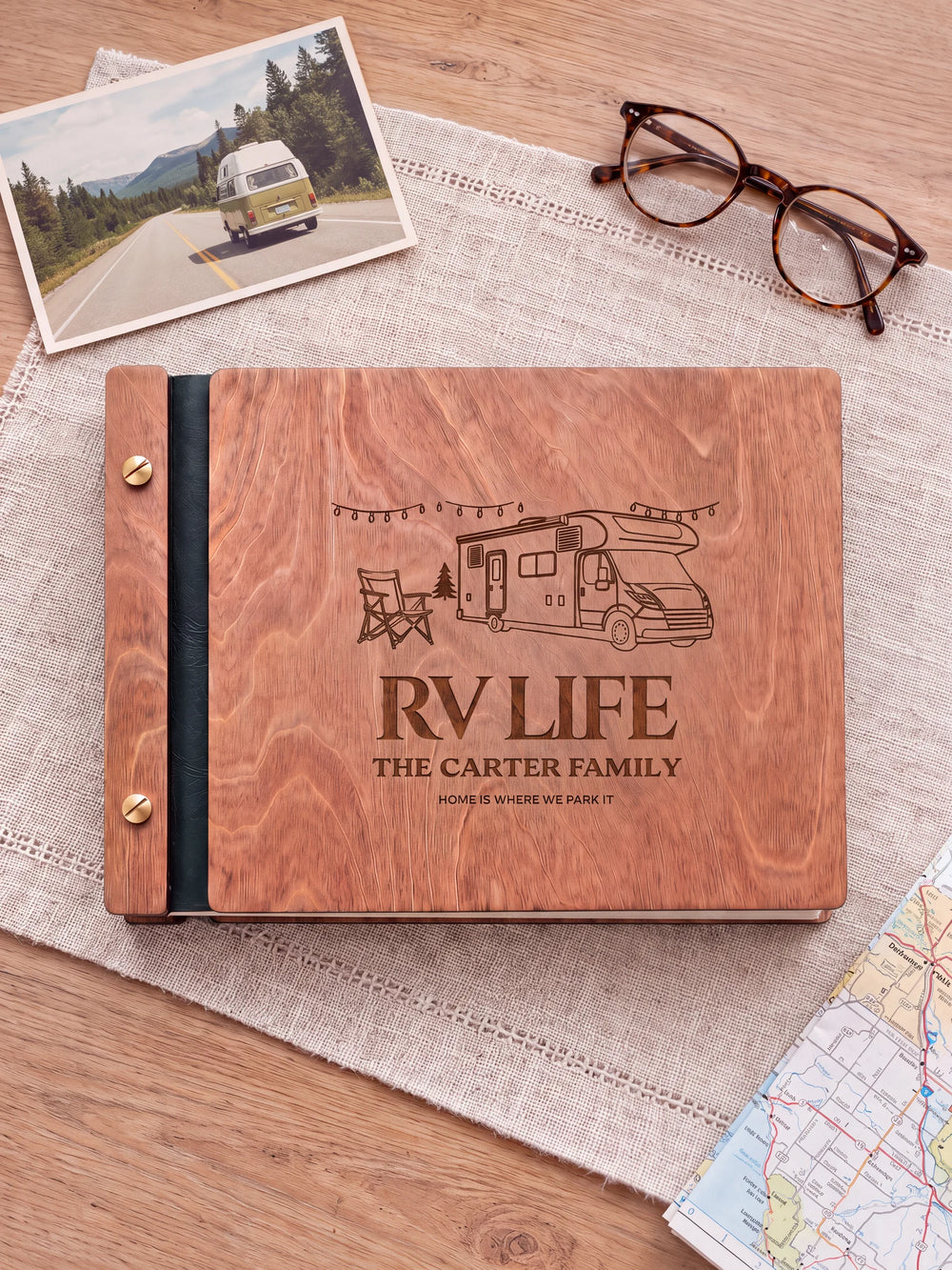 The full Hazelnut RV LIFE album cover is shown close up. Brown engraved artwork, personalized wording, the narrow binding and gold screws are visible.