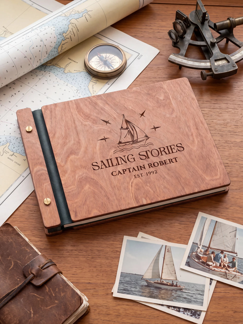 The full Hazelnut SAILING STORIES album cover is shown close up. Brown engraved artwork, personalized wording, the narrow binding and gold screws are visible.