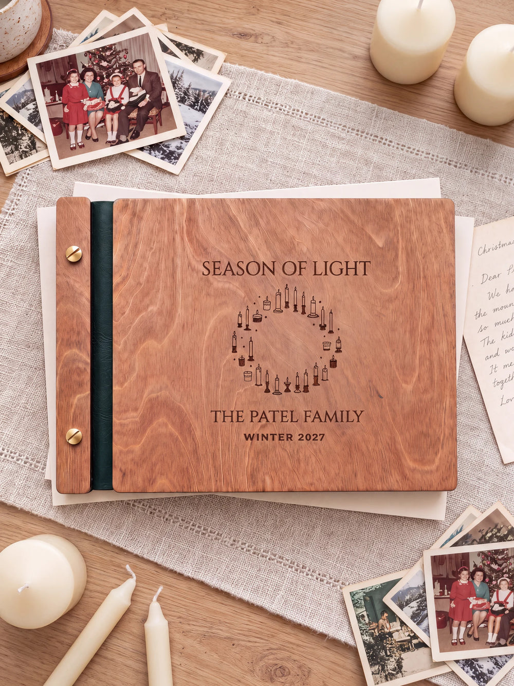 The full Hazelnut SEASON OF LIGHT album cover is shown close up. Brown engraved artwork, personalized wording, the narrow binding and gold screws are visible.
