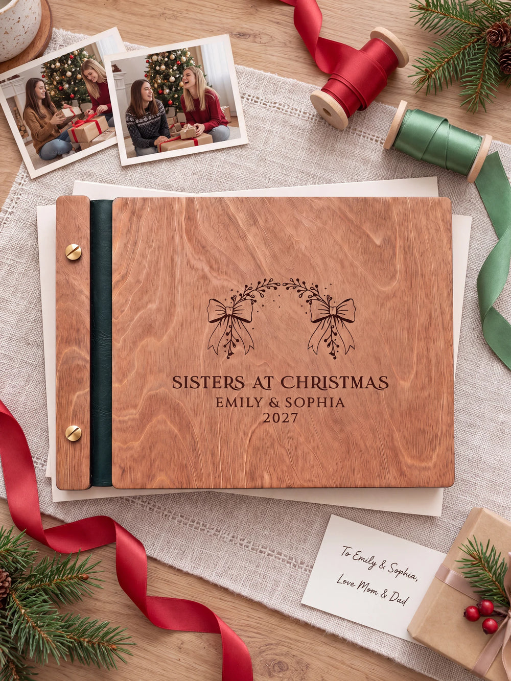 The full Hazelnut SISTERS AT CHRISTMAS album cover is shown close up. Brown engraved artwork, personalized wording, the narrow binding and gold screws are visible.