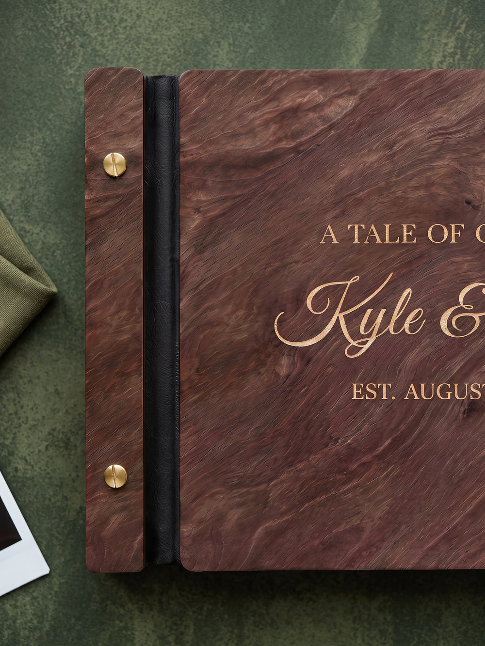 A Tale of Our Love photo guest book with a Jacobean wood cover, vegan leather spine and screw posts