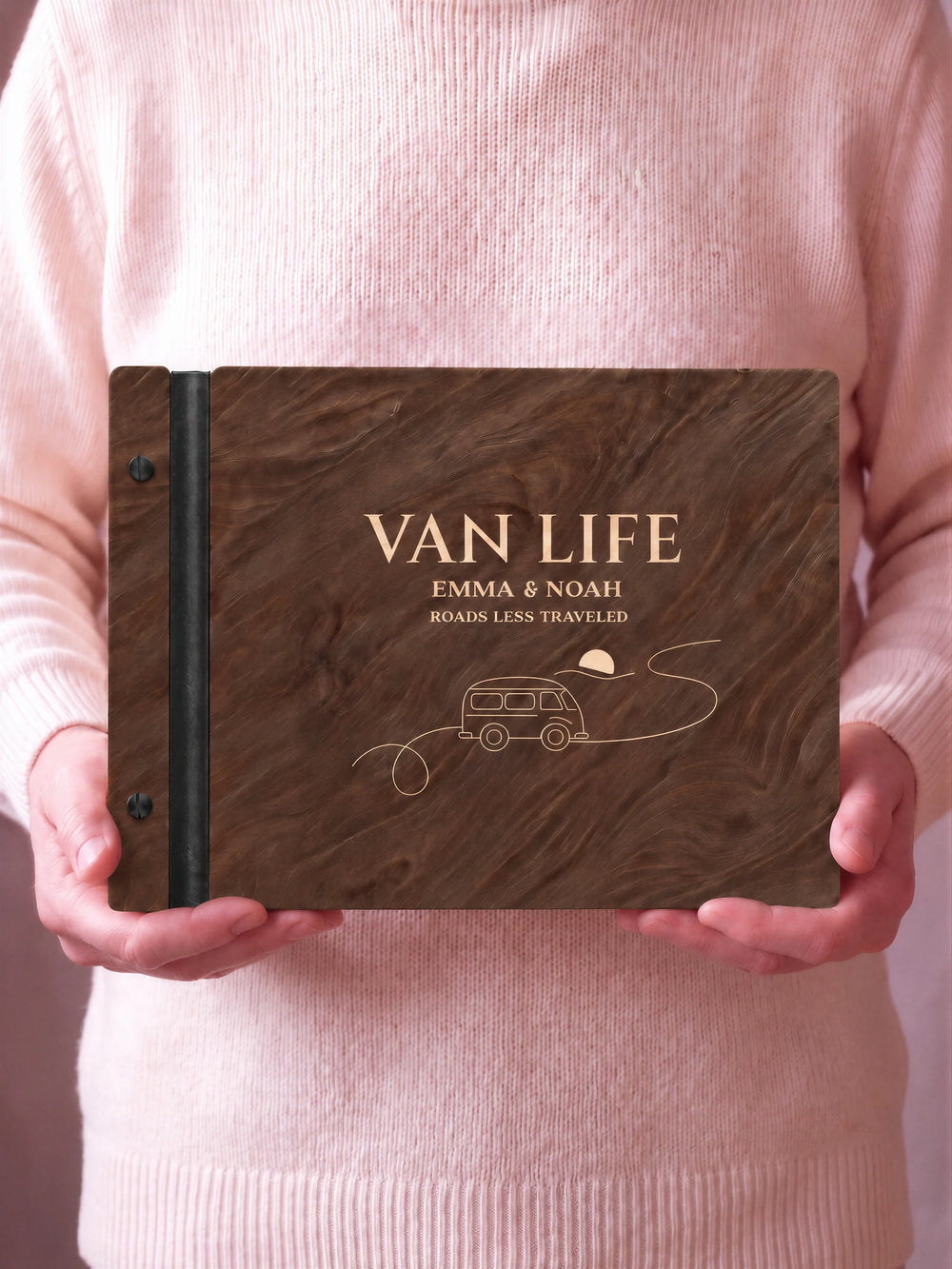 A close view of the dark brown Jacobean album and its cream laser-engraved VAN LIFE design, with black binding and matte black screws.