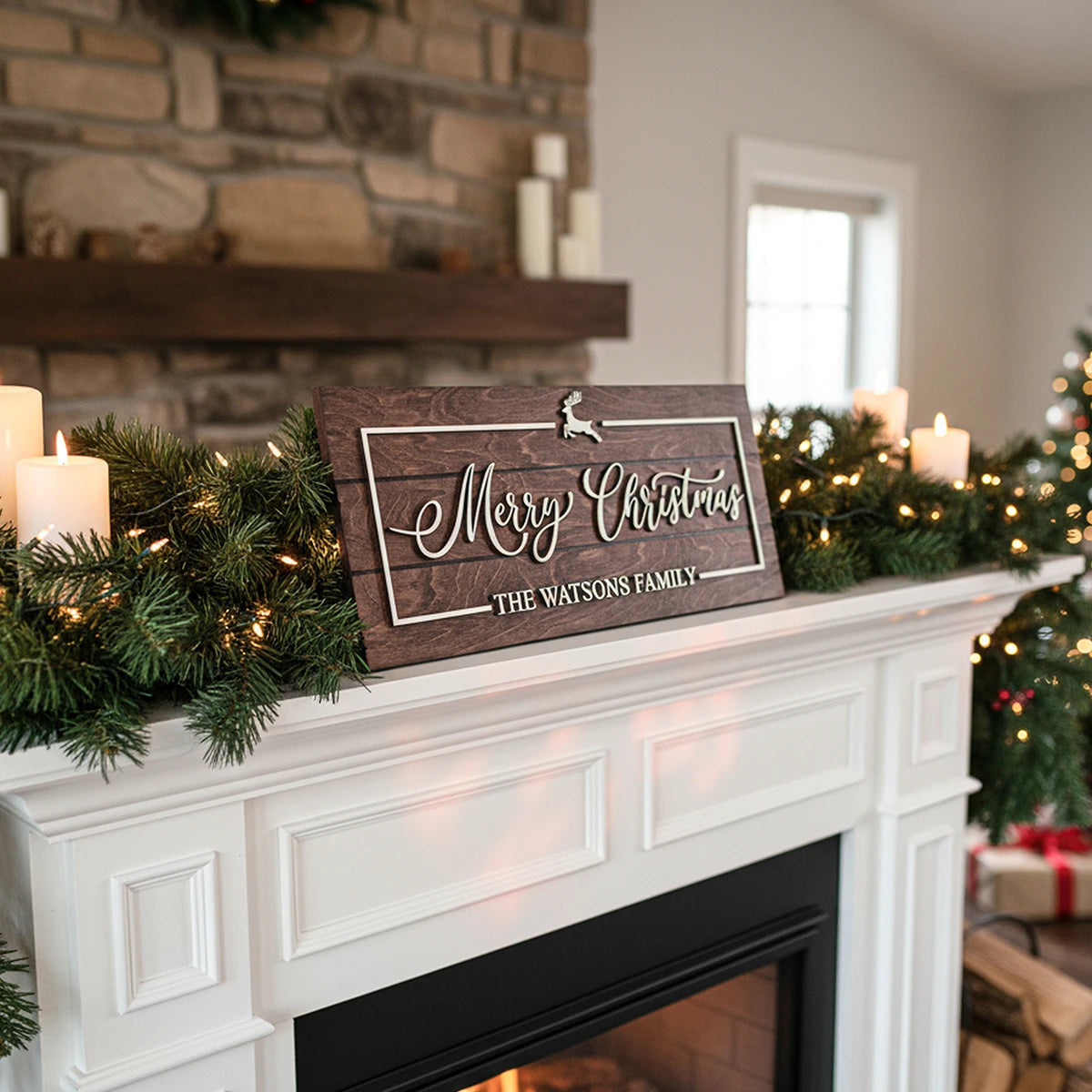Decorative Christmas sign on a mantelpiece with candles and garland.