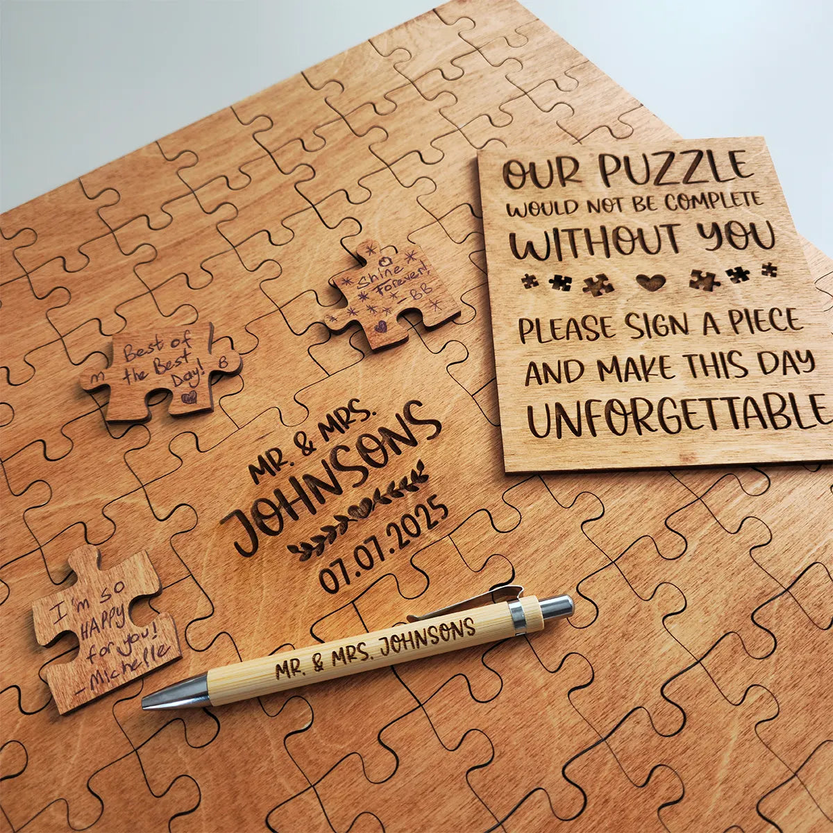 Wooden puzzle with engraved text and a pen on a light gray background